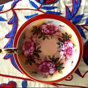 Vintage Terra Cotta Orange Teacup w/ floral interior + matching saucer